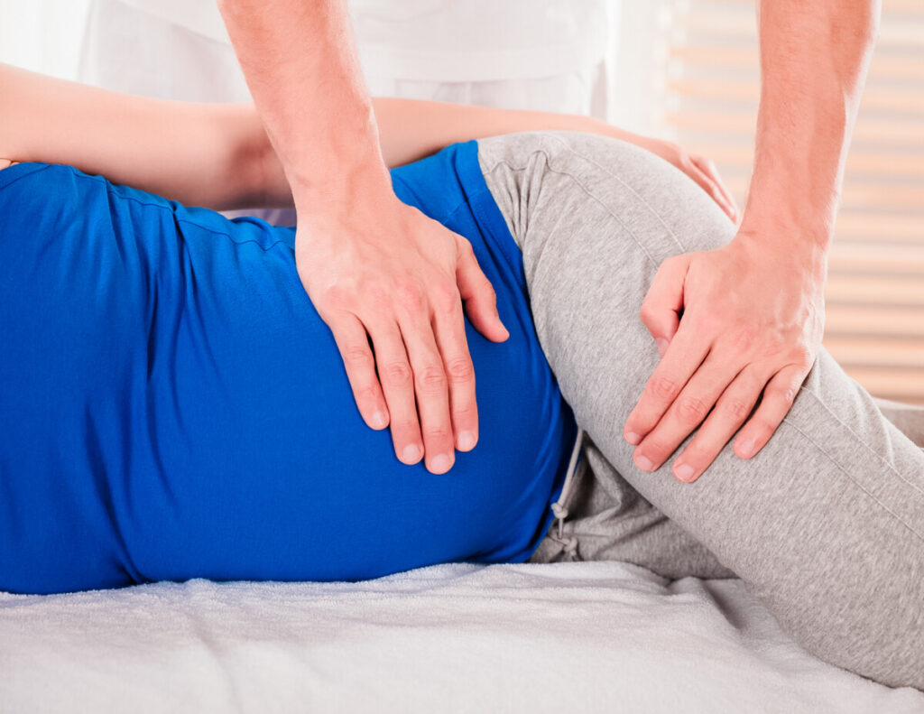 Pregnant patient receiving a prenatal chiropractic adjustment