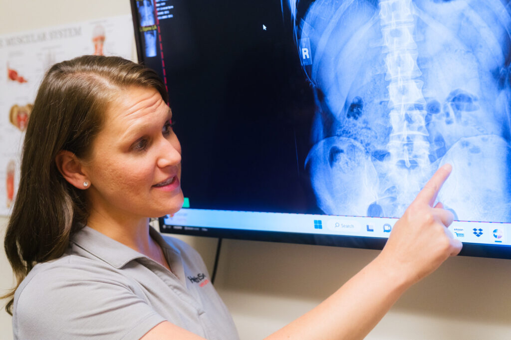 Dr. Sarah Stranko, at HealthSource of Avon, reviewing patients x-ray findings