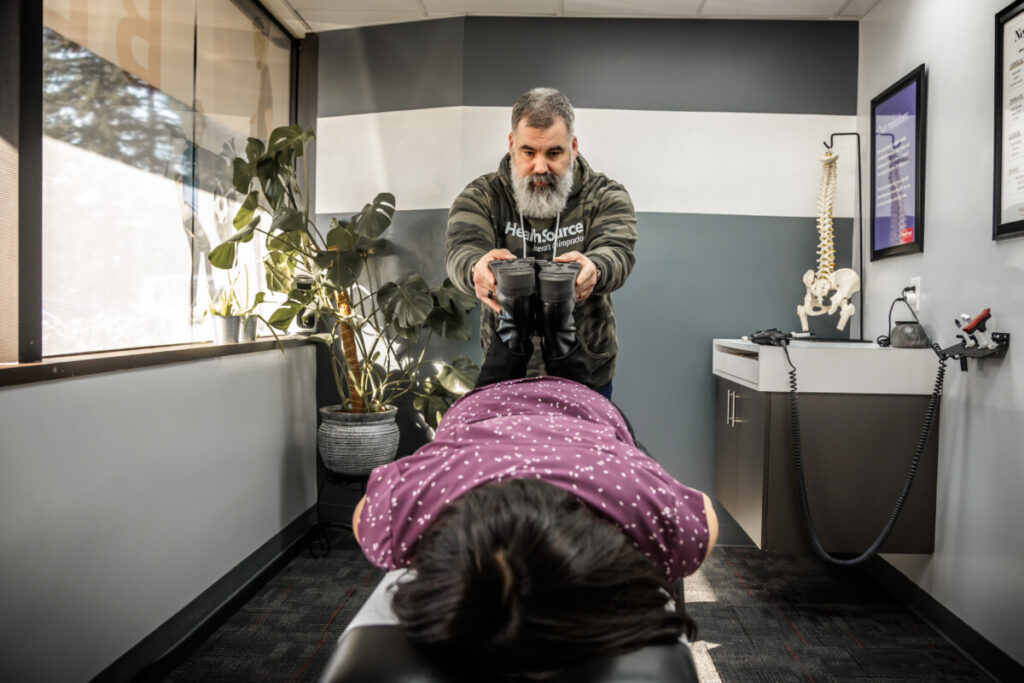 Dr. Josh Pepping adjusting a chiropractic patient at HealthSource of Federal Way.