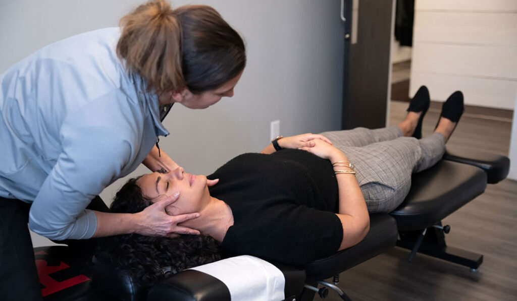 Dr. Ashley Rice, Doctor of Chiropractic, adjusting a chiropractic patient at HealthSource of Boardman