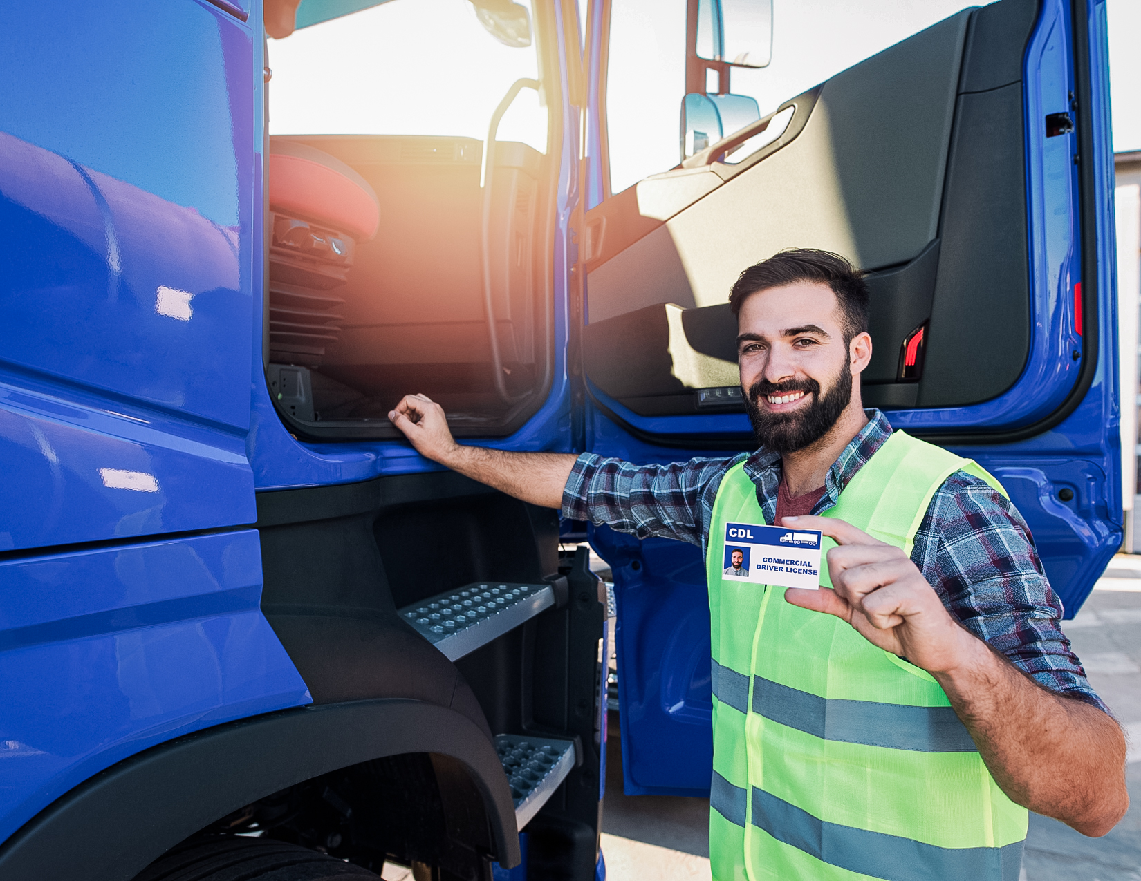 Happy truck driver with uniform showing ID