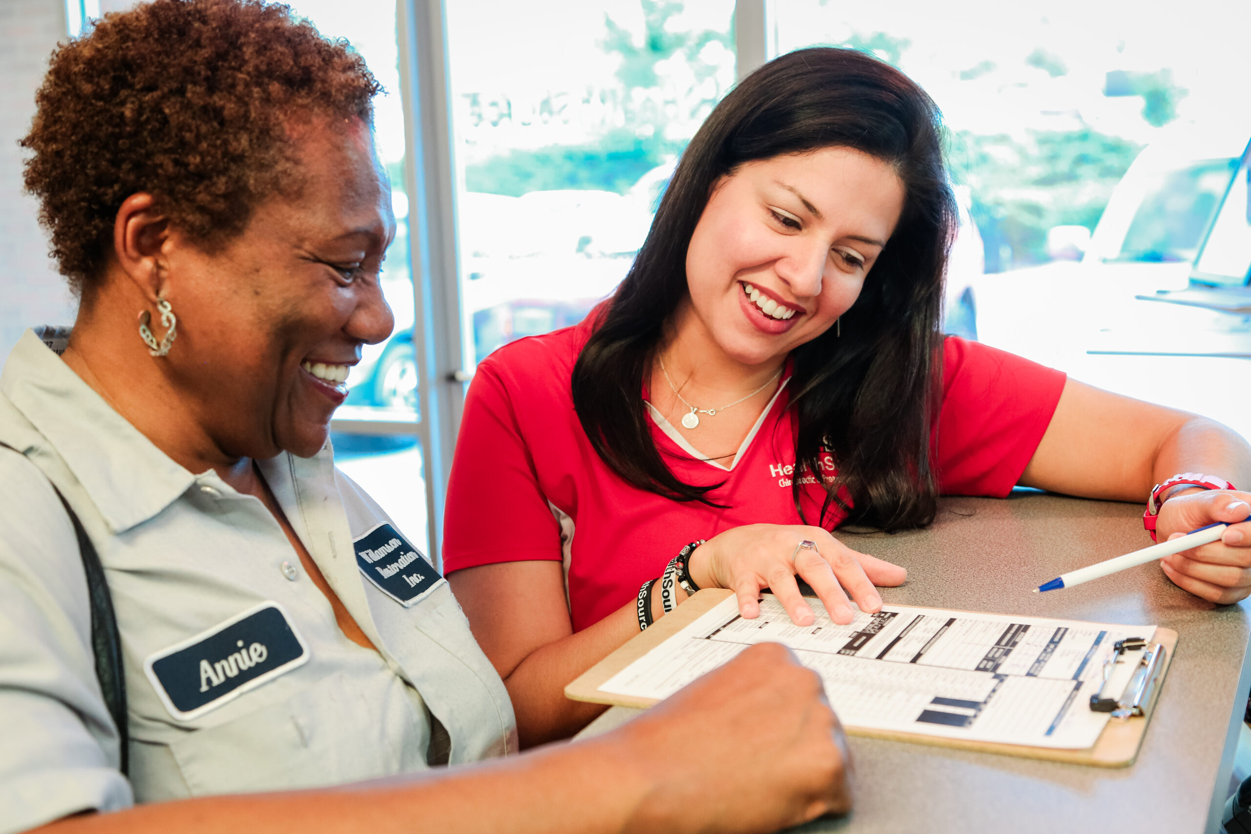 Reviewing terms and agreements with patient.