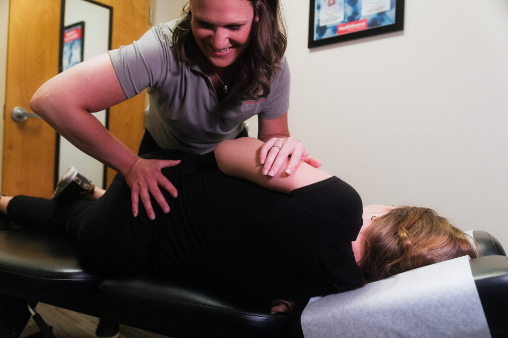 Dr. Sarah Stranko at HealthSource of Avon giving a patient a chiropractic adjustment