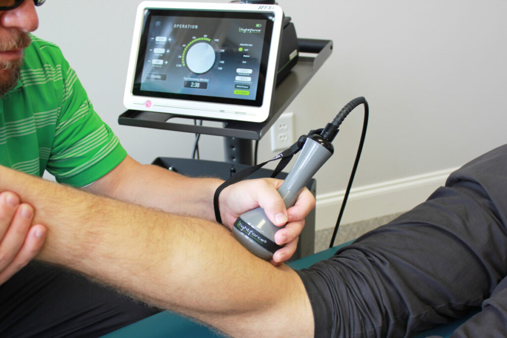 Patient receiving Laser therapy treatment on their calf.