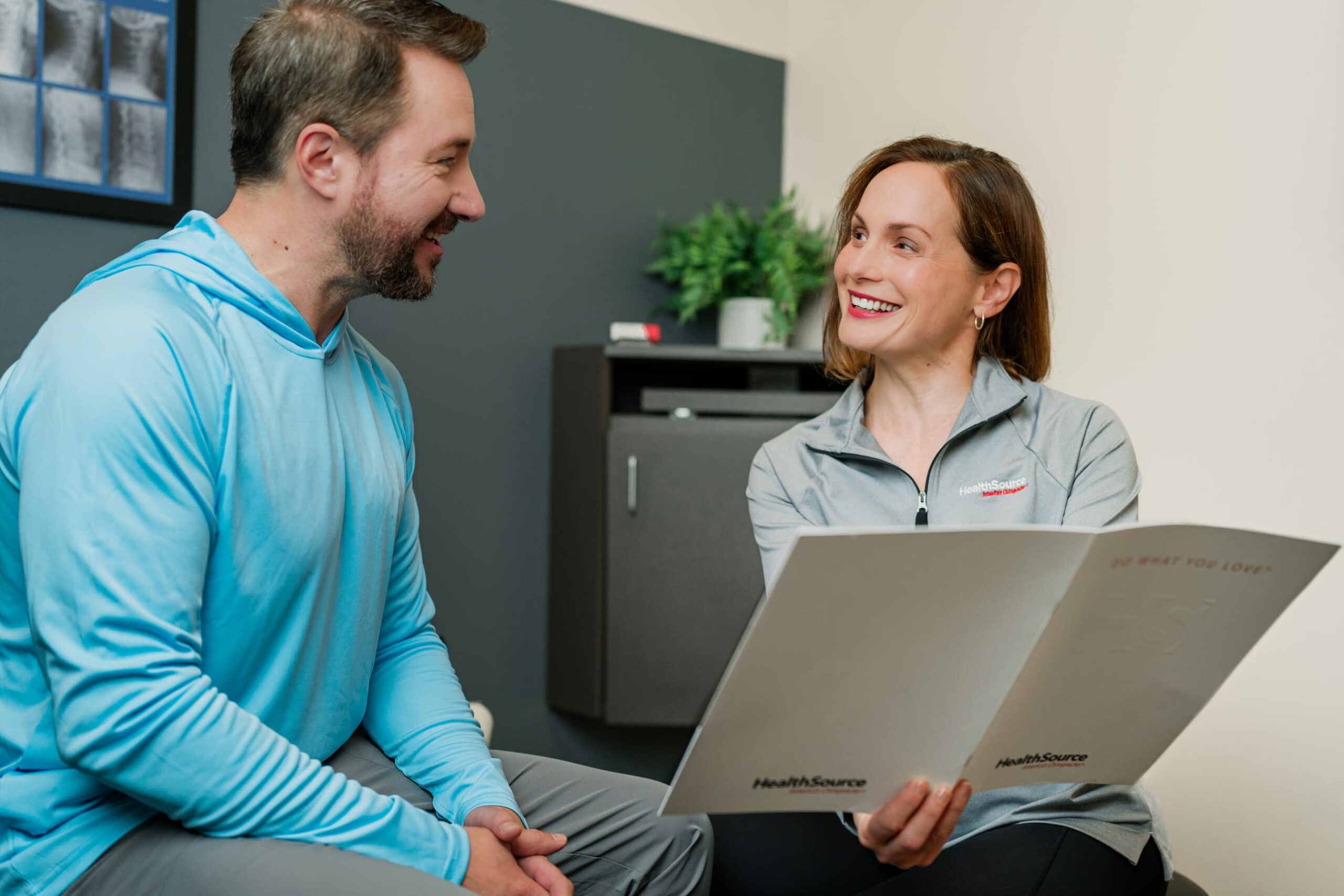 A practitioner discusses care plan options with a patient.