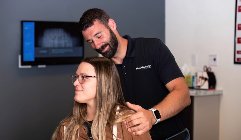 Dr. Rob adjusting a chiropractic patient at HealthSource of Marshall.