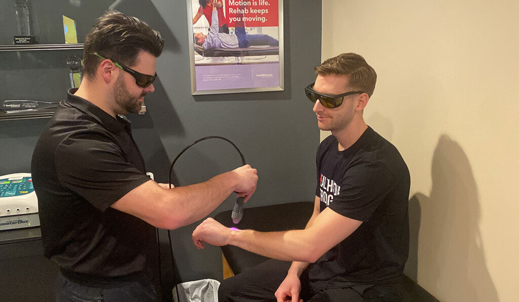 A patient being treated with Laser Therapy at HealthSource of Troy